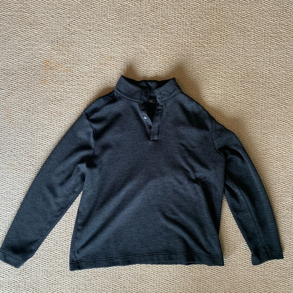 Greg Norman pullover.